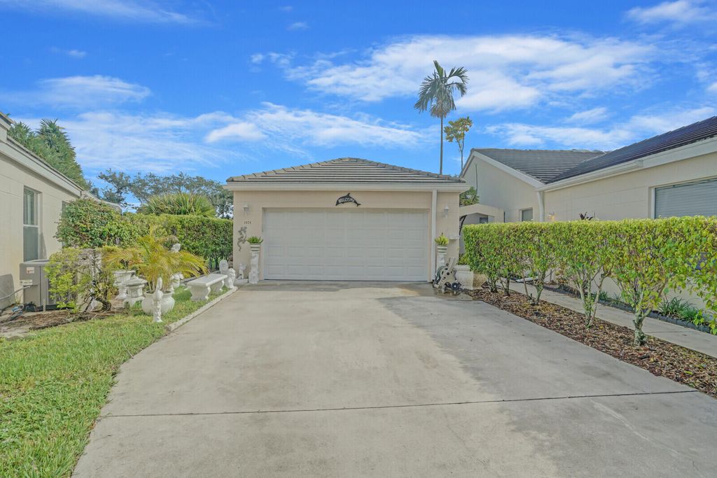 Photo of 1024 Island Manor Drive, Greenacres, FL 33413 (MLS # R11019479)