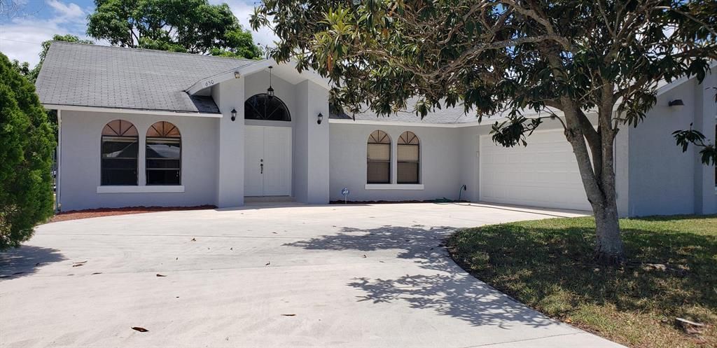 Photo of 650 SW Ester Avenue, Port Saint Lucie, FL 34983 (MLS # R10720531)