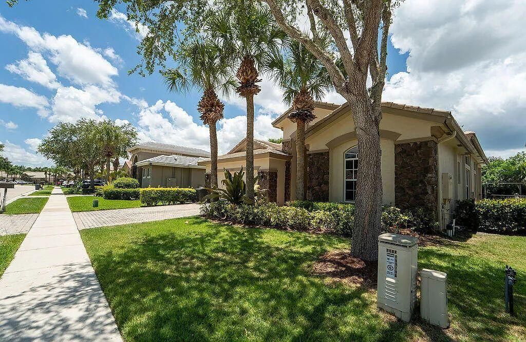 Photo of 11218 Osprey Lake Lane, Palm Beach Gardens, FL 33412 (MLS # R11156668)