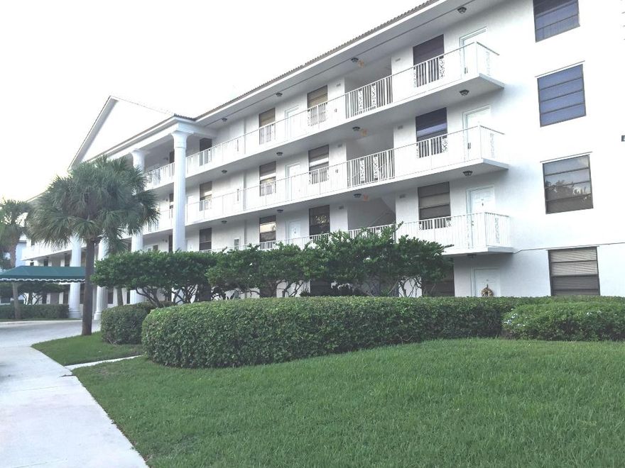 Don't miss out on this clean, upgraded condo in lovely gated community near downtown West Palm Beach, the new outlet mall and Whole Foods.  Recent updates include laminate floors, new blinds, updated vanities, new toilets, & has been newly painted in neutral colors. All popcorn has been removed & now all walls & ceilings are knock-down finish. The master bedroom faces green space & has a huge walk-in (approx. 8'9'' x 6') Laundry room has large bonus area that could be an office or storage room. Serene views of pool & green space. This community has a manned guard gate and on-site property manager.  There is plenty of parking throughout the community & beautiful community pool.