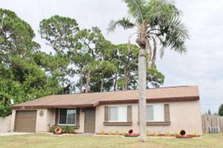 This cozy 2/2/1 has new carpeting, and new landscaping and is ready to move into today.  The spacious kitchen is perfect for that someone who likes to cook and bake.  The over sized fenced in back yard is perfect for a weekend barbecue with your family and friends. Located close to shopping, dining, I-95, Florida's Turnpike and so much more...