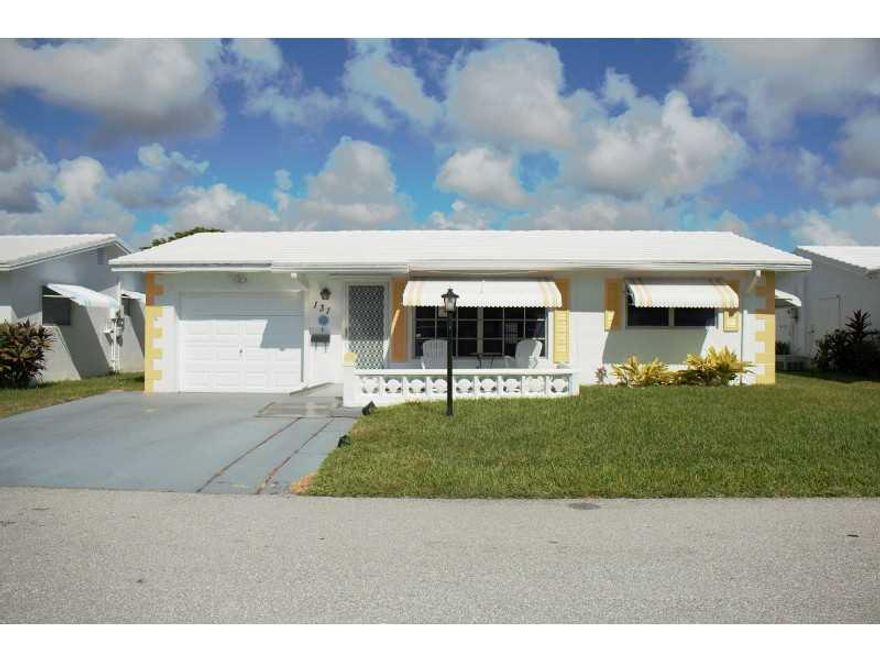 Lovely 2 bedroom, 1 bath home in the very desirable Leisureville!!!  Remodeled bathroom w/ tile and Shower stall, Florida room converted to a large Family room. 1 car garage w/ extra refrigerator, Generator Hook Up.  Community is 3 miles from the Beach! T ons of amenities to enjoy including 2 pools, Sauna, 9 hole golf course, Shuffle & Bocce Courts & Sewer & Water. Very Active Senior community with many Social Events daily.  Maintenance incl. lawn care & painting house. No Land lease.  Don't miss this one!