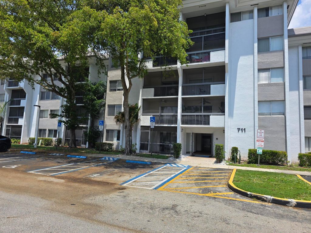 Photo of 711 N Pine Island Road #213, Plantation, FL 33324 (MLS # B26022402)