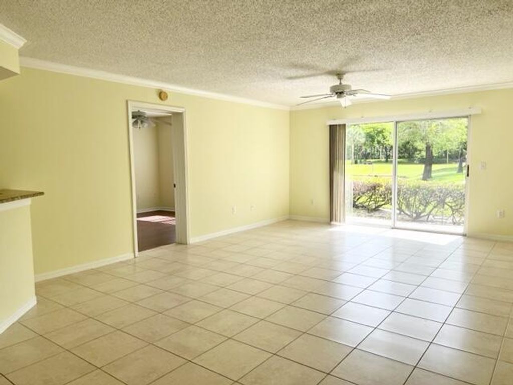 Photo of 800 S Crestwood Ct Court S #811, Royal Palm Beach, FL 33411 (MLS # B26011614)