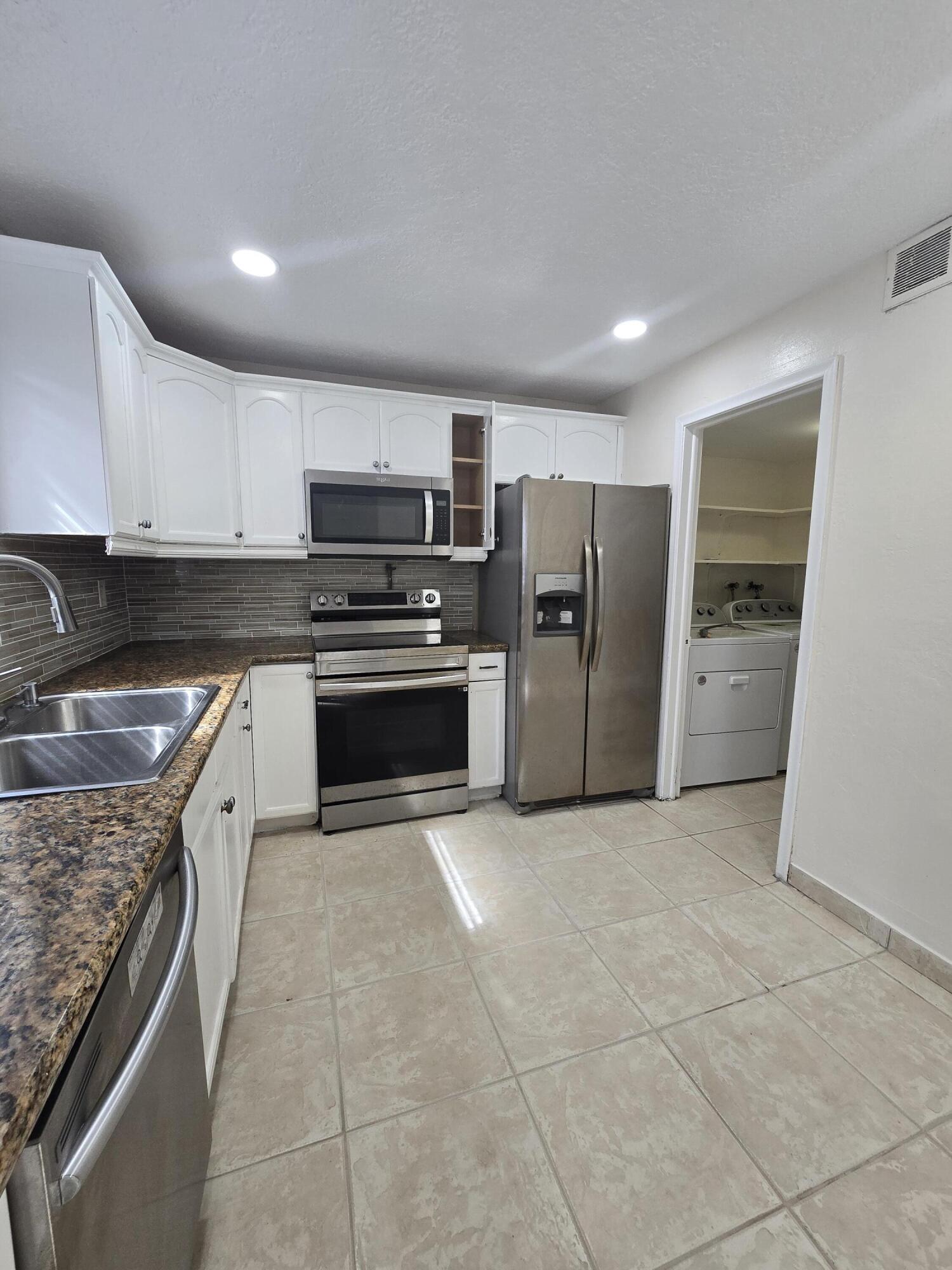 Beautiful and spacious 3-bedroom, 1.5-bath townhouse-style condo available for rent in the heart of Coral Springs. This well-maintained home features a private fenced yard, modern full bathroom, water-resistant laminate flooring upstairs, tile throughout first floor, ceiling fans, and an in-unit laundry room with full-size washer & dryer. The property is located across the clubhouse. It is almost like having your own pool. Don't miss out on this opportunity.Located in a quiet community zoned for top-rated schools and within walking distance to shopping and dining. Convenient access to Sawgrass Expressway, Sample Rd, and University Dr.