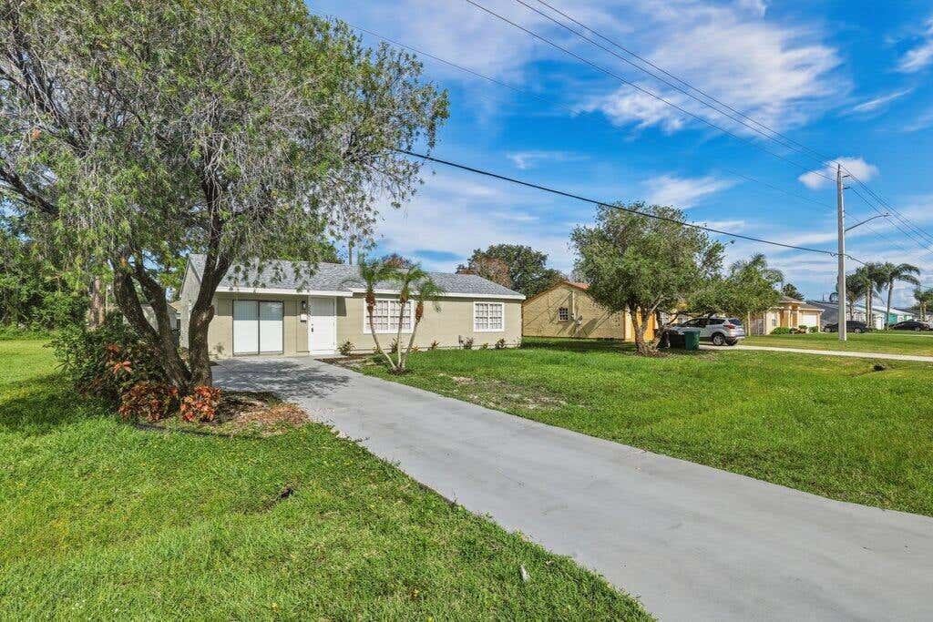 Photo of 2521 SE Berkshire Boulevard, Port Saint Lucie, FL 34952 (MLS # B26049557)