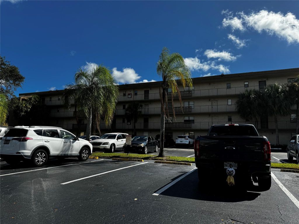 Photo of 9300 SW 8th St #401, Boca Raton, FL 33428 (MLS # F10408593)