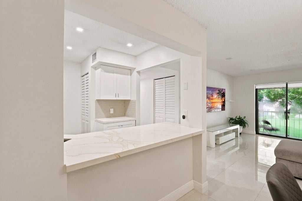 Photo of 609 SEA PINE Way #F2, Greenacres, FL 33415 (MLS # B26063977)