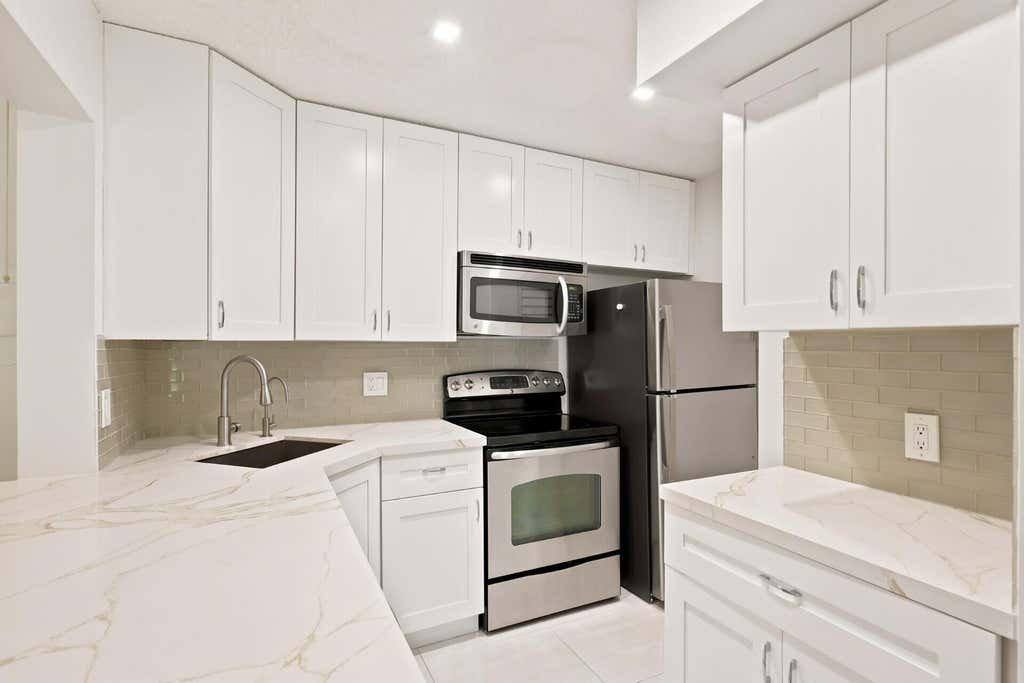 Photo of 609 SEA PINE Way #F2, Greenacres, FL 33415 (MLS # B26063977)