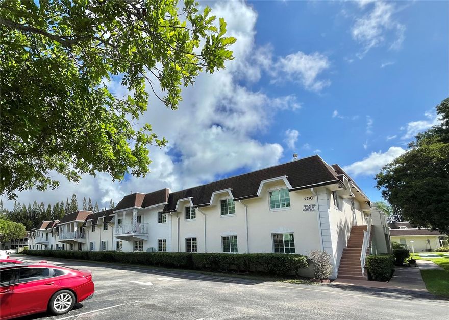 Great price for this 2-bed/2-bath ALL AGES condo. Located on the second floor, this bright unit features wood-look tile throughout, a spacious kitchen with ample cabinets, and a freshly painted interior, ready for your personal touches. The master bedroom has a walk-in closet, while the guest bedroom provides comfortable space for family or visitors. In-unit washer and dryer, accordion shutters, newer A/C handler (2020) add convenience and peace of mind. Step out to a covered balcony with partial views of the pool and garden grounds. The community includes a clubhouse, pool, sauna, and billiards, all with low monthly fees. Just minutes from Deerfield Beach, Mizner Park, Boca Towne Town Center mall, waterfront dining, and major highways, Ready for full-time living or a seasonal retreat.