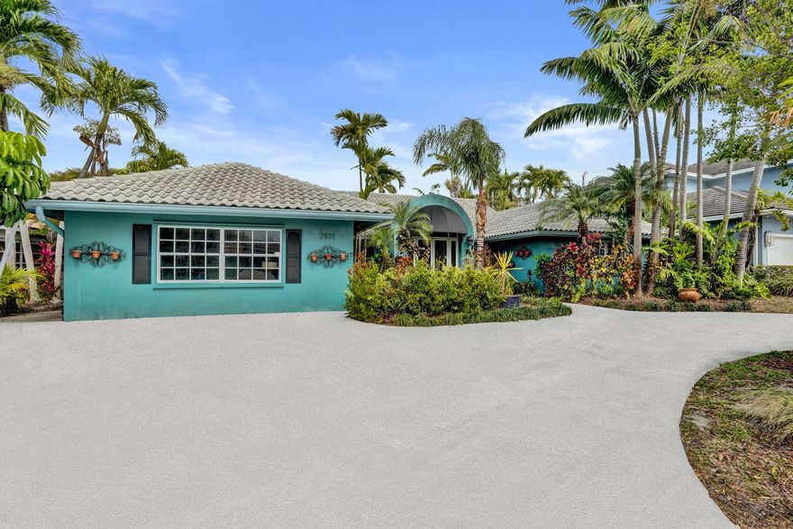 Tucked away on a quiet street in the highly sought-after Lighthouse Point neighborhood, this 3BR/2.5BA home offers a rare chance to create your dream home in an exceptional location. Just steps from Lake Placid Park and close to the water, the home features stacked bedrooms, a spacious living area with fireplace, circular driveway, and a versatile game room that can be converted back to a garage. The screened-in lanai opens to a large pool with sundeck and tiki hut, perfect for relaxed coastal living. With great bones and endless potential, this is an opportunity to customize a home in one of the area's most desirable neighborhoods.