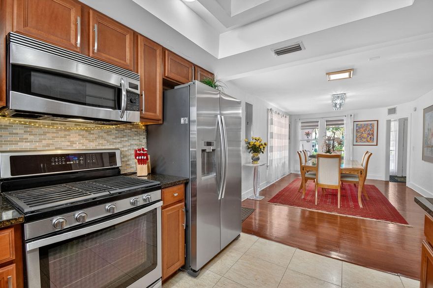 Welcome to 328 Monroe Dr! This home is an opportunity to own a sensational Mediterranean Revival home with Colonial Revival influences in Southland Park in West Palm Beach. It is ideally located within West Palm Beach and adjacent to Antique Row. This unique home offers unbeatable access to downtown West Palm Beach, SoSo, the island of Palm Beach, Worth Avenue, Palm Beach International Airport and I-95. This property also offers a prime opportunity for renovation supporting upside potential, allowing a new owner to update and customize to their taste while increasing overall value.   The main house offers three bedrooms and three full bathrooms, with a formal dining room, formal living room and plentiful entertaining/living space on the first floor.  The second floor primary retreat features a walk in closet/ dressing room and sitting room with expansive windows offering an abundance of natural light.  New 2022 roofs and partial impact windows and partial window shutters offer peace of mind without sacrificing original architectural details.  The larger than standard guest house is equipped with a full kitchen, living room, bedroom, bathroom and walk in closet.