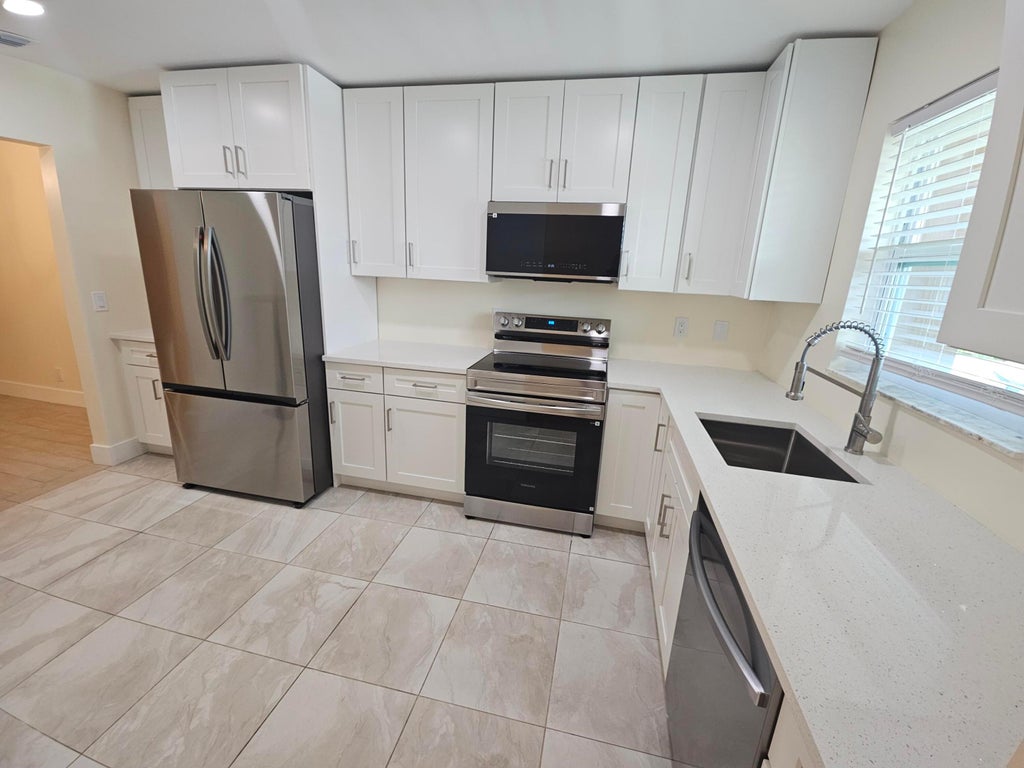 Photo of 5780 Fernley Drive W #89, West Palm Beach, FL 33415 (MLS # B26075616)