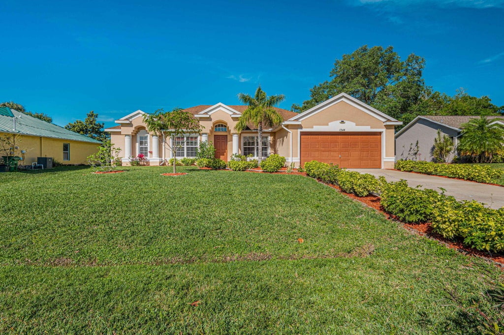 Photo of 1244 SW Empire Street, Port Saint Lucie, FL 34983 (MLS # R10967817)