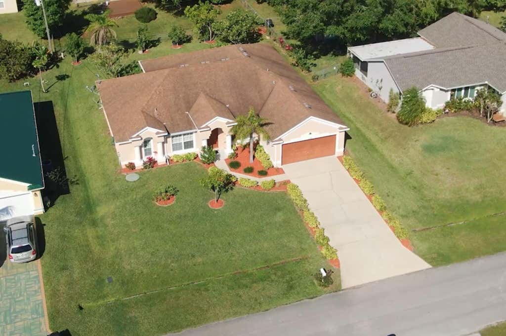 Photo of 1244 SW Empire Street, Port Saint Lucie, FL 34983 (MLS # R10967817)