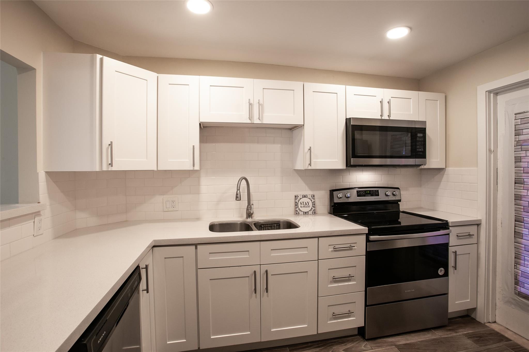 This unit has been redone from top to bottom. The kitchen has been opened and redesigned with new lighting, ss appliances, microwave, subway tile backsplash, quartz counter tops, and new cabinets/drawers with soft close feature. The unit has matching tile throughout - yes, even on the patio out back. You'll love the golf and garden views. Palm Aire residents get free internet, cable tv, water and pest control service. The master bath is one of a kind and completely renovated as well. It has a double sink vanity, updated lights/fan, and a gorgeous shower. Master bedroom also has a private sitting area and the closet has an organizing unit. Upfront is a half bath, all new, for your quests. This is a must see!