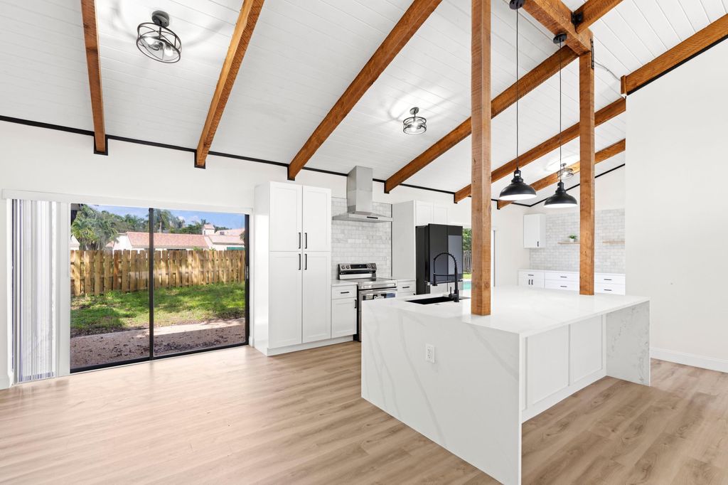 Photo of 6299 Hollandaire Drive E, Boca Raton, FL 33433 (MLS # R11021362)