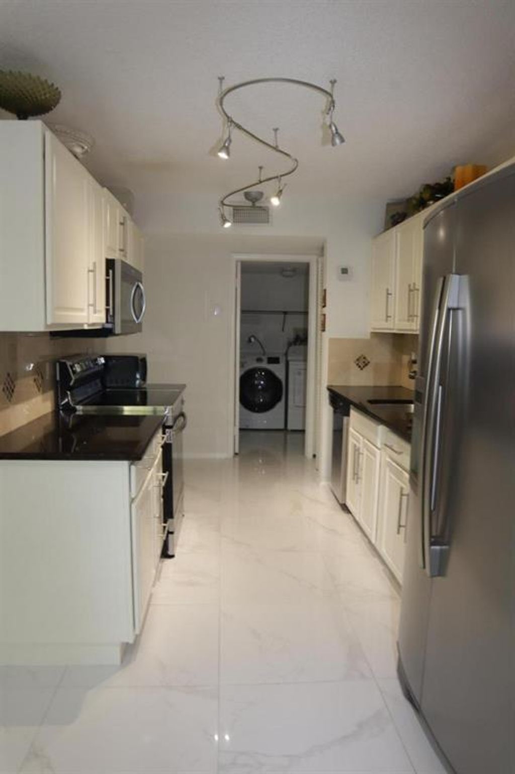 Photo of 3800 NW 23rd Court, Coconut Creek, FL 33066 (MLS # B26016092)