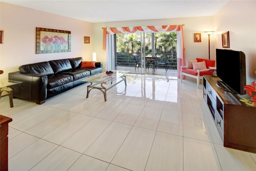 Your beach condo is turnkey.  Pack your bags and put the key into the door.  Cheerful, spacious, Light and bright. Combo living/dining with porcelain tiles. Screened in terrace with garden/golf view.  East/west tropical, balmy breezes throughout your new home.  Plenty of walk-in closet space.  Unique pink bathroom or re-glaze that color. Large main bedroom with private door to your terrace and extra thick bamboo flooring. Undercover parking space.  Finishing 50-year certification shortly and paid by seller.  New roofs on all buildings in the complex.  Concrete restoration, water proofing and painting has already been completed.  No leasing for first 2 years.  One person must be age 55 or over.  No pets.  Undercover parking space.  Near shops, transportation, entertainment and the beach,