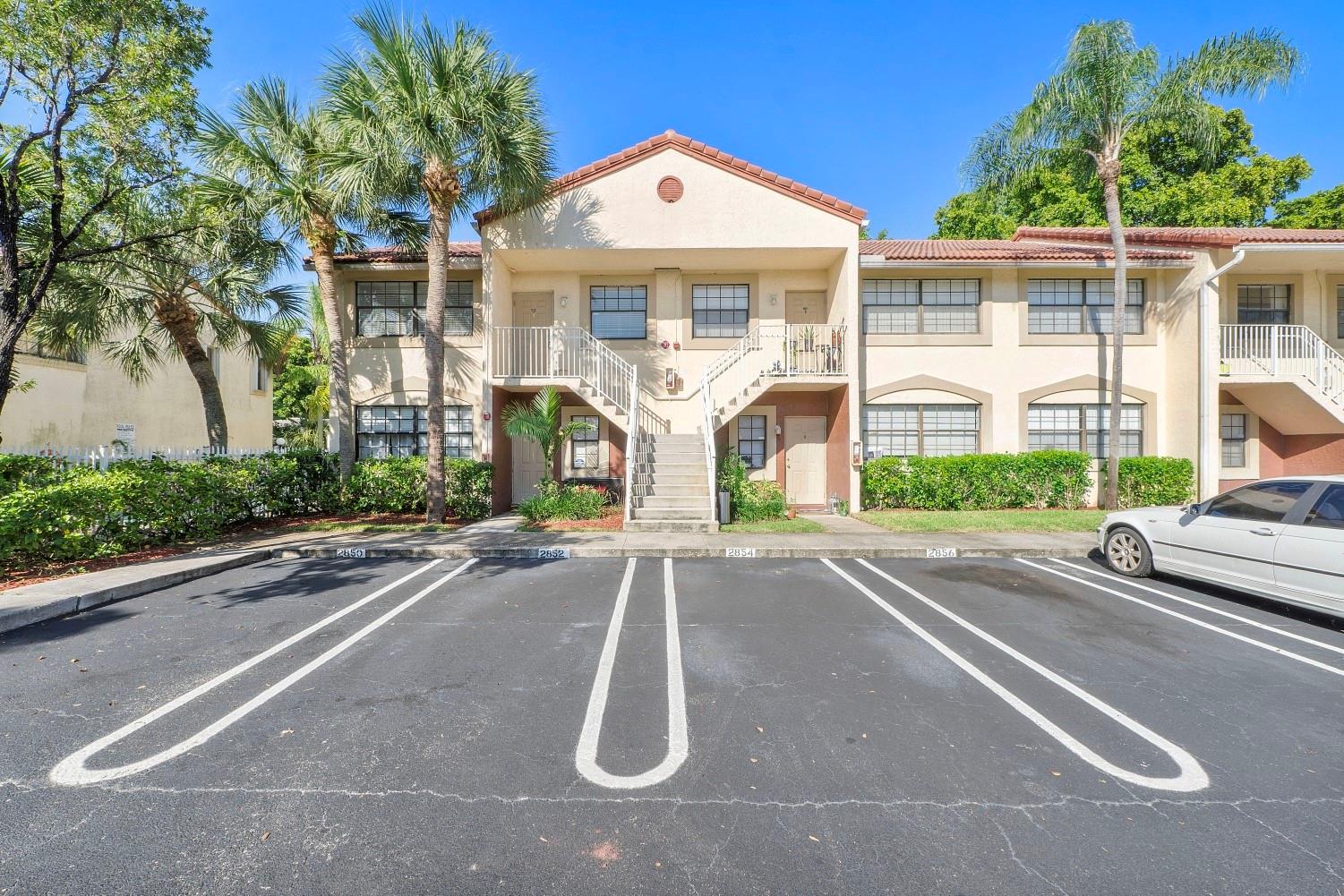 This unit shows like a model! Spacious and bright 2BR/2BA first-floor condo located in the heart of Coral Springs. Features include granite countertops in the kitchen and bathrooms, upgraded appliances and cabinetry, neutral paint and tile throughout, and laminate floors in the bedrooms. Floors were recently refinished. Full sized washer and dryer in unit. One assigned parking space & guest parking. The building also shines with fresh paint and a new roof in a well-maintained community. Ideally situated across from Mullins Park, Coral Springs Center for the Arts, restaurants and shopping. The association dues include insurance & community pool! No reserves. Pets allowed under 15 lbs. Pride of ownership is evident—this is a must-see!