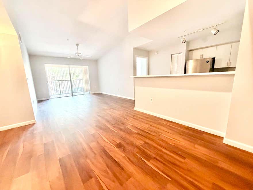 Beautiful move-in ready 2BR/2BA condo in desirable Carrington at Coconut Creek! This spacious second-floor walk up unit features vaulted ceilings, updated vinyl and tile flooring, open living areas, walk-in closet, pantry, private balcony, and in-unit washer & dryer. Bright split-bedroom layout offers comfort and privacy. Resort-style community amenities include pool, tennis courts, clubhouse, and BBQ area. Prime Coconut Creek location near Sawgrass Expressway, shopping, restaurants, parks, and top-rated schools.  Easy to show!