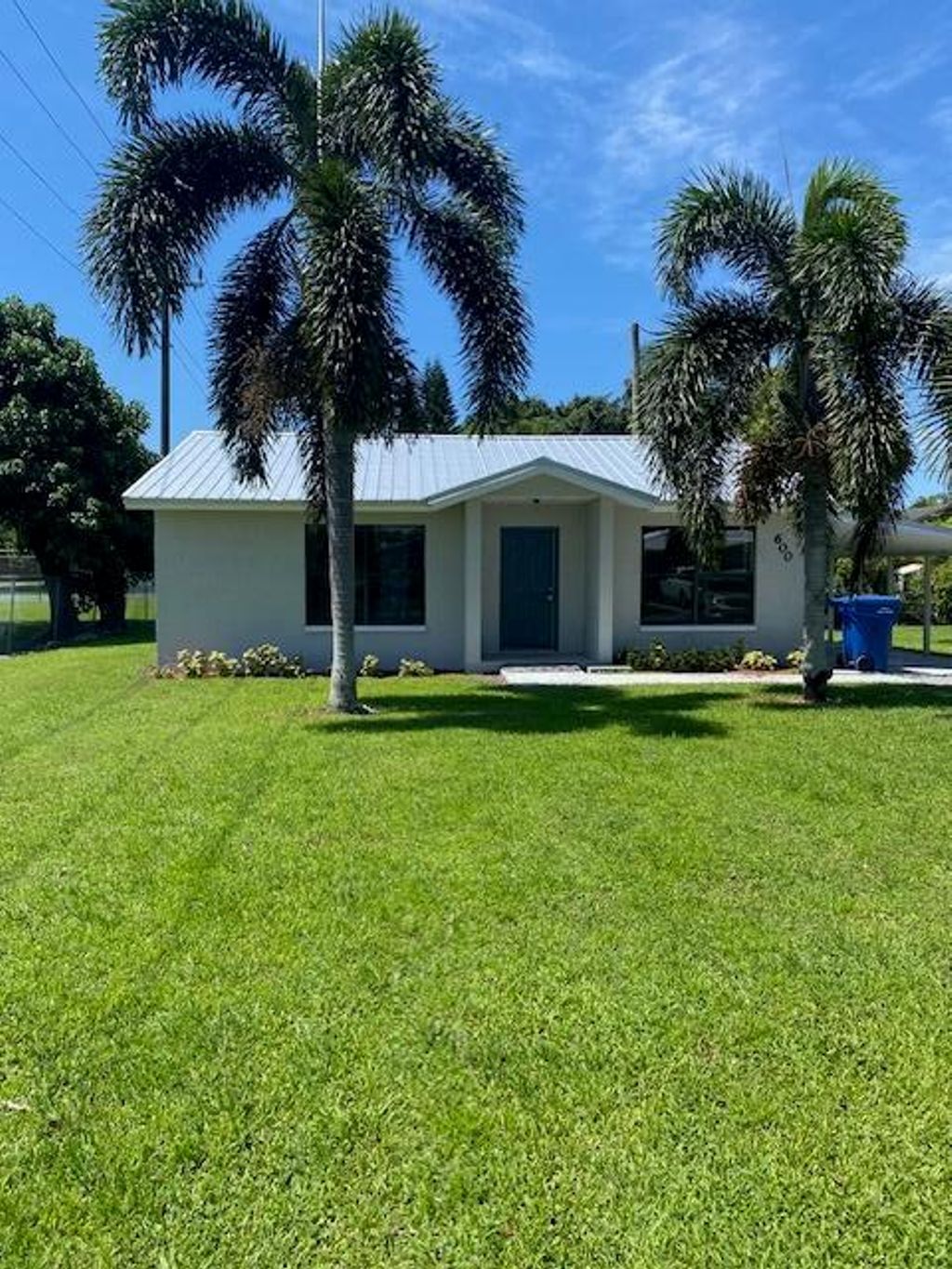 Photo of 600 NW Avenue G, Belle Glade, FL 33430 (MLS # R10900198)