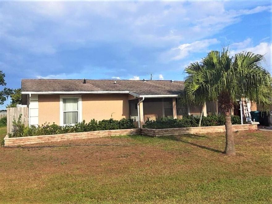 Welcome to Florida living in a quiet well-situated part of Port St. Lucie. This 2 bedroom, 2 bath CBS Home also enjoys a large Florida room.  An 11' X 20'  1-car garage also has extra space for storage, water heater & washer & dryer.  A large 6' X 24' under roof screened sitting porch provides a nice foyer entry and sitting area for cooler days.  There is also an 8' X 20' Screened porch under roof in back.  The home is cozy and well-designed and would be a welcome starter or retirement home.  It has 1,298 square feet under Air, and 1,930 square feet overall. Fine CBS construction with key ways & cornerstones. Central Heating & Air Conditioning system.
 The Primary bedroom is large and capable of holding a King size bed and accompanying dressers, large paddle fan over bed, and is en-suite bathroom with full tub & shower, stool & sink. Two custom designed windows provide an Eastern exposure.. Lots of closet space and also storage closets along the hall between primary and second bedroom. The 2nd.bedroom has full closets, large paddle fan. The Hall bath has been completely remodeled and re=tiled less than six months ago, and has tub & shower, stool and sink. Living room has a fireplace with mantel. Formal dining room with adequate space for China cabinet or buffet hutch. The Florida Room is very large, 11' X 27'.  Kitchen is galley style, straight through to garage. Has stove, refrigerator & microwave.
Appliances will stay with the home, a gas stove, refrigerator, and microwave, also in place washer & dryer.  Also utility shed in backyard.  Water heater like stove is LP/bottle gas, tank buried in front yard is leased.
Electric power is provided by Florida Power & Light Company, water & sewer by Port St.Lucie Utilities. There is an existing well pump system that is not warranted but would provide cheap available extra water for gardening or car washing. The house is situated on a large 1/4 Acre Lot, 85' X 125', with a large fenced back yard, wood privacy fenced on back.  Large tin storage shed for gardening & yard implements, lawnmower.
This home is centrally located just off Floresta Avenue with quiet streets but easy access to St. Lucie West, I-95 and the Florida Turnpike.  This home is currently undergoing probate process but should be ready to deliver in the first part of May.