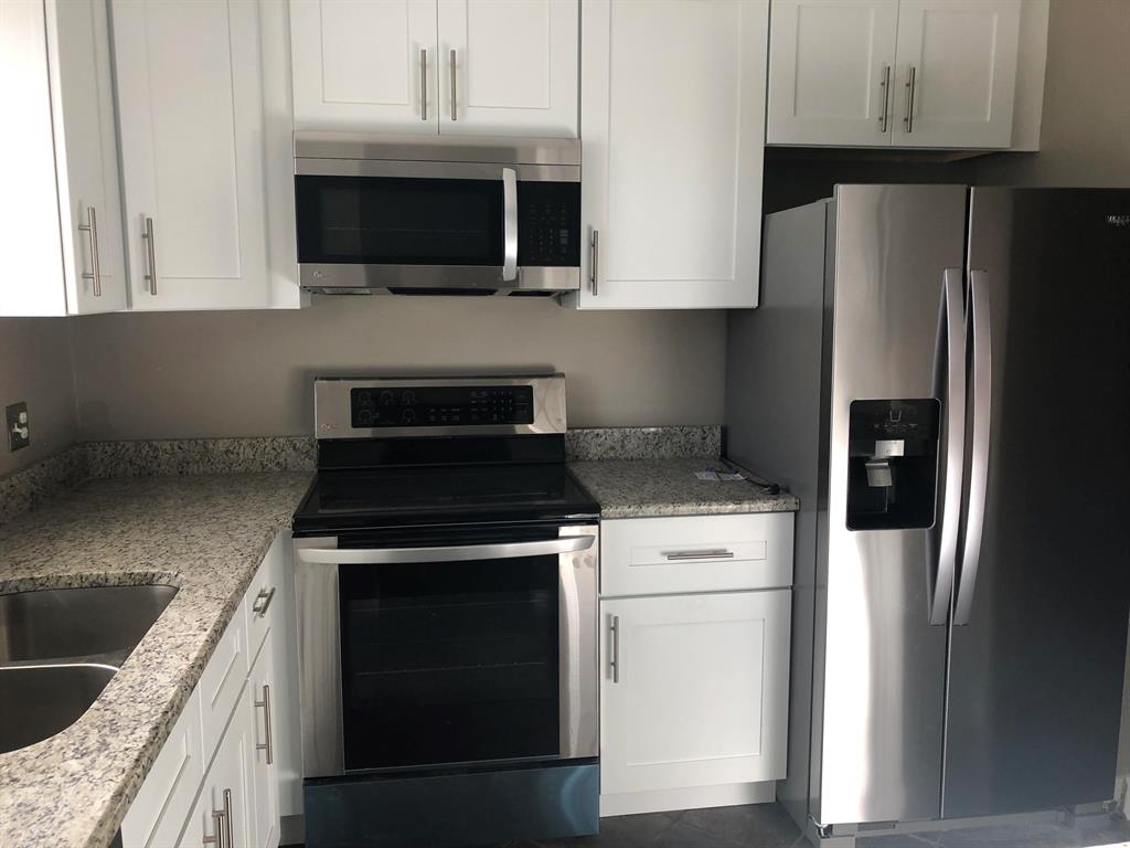 Renovated kitchen with stainless steel appliances and soft close white cabinetry in the kitchen. New Air conditioner. The master bedroom features 2 closets, one being a walk in with custom cabinetry. Wood floors throughout. Exterior has new balcony railings, paint and stucco. Great value for the location. Must See!