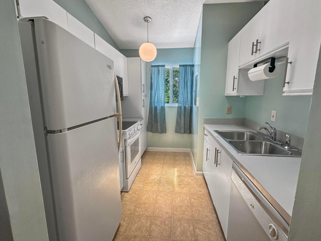 Photo of 5747 Deer Run Drive #1L, Fort Pierce, FL 34951 (MLS # B26074547)