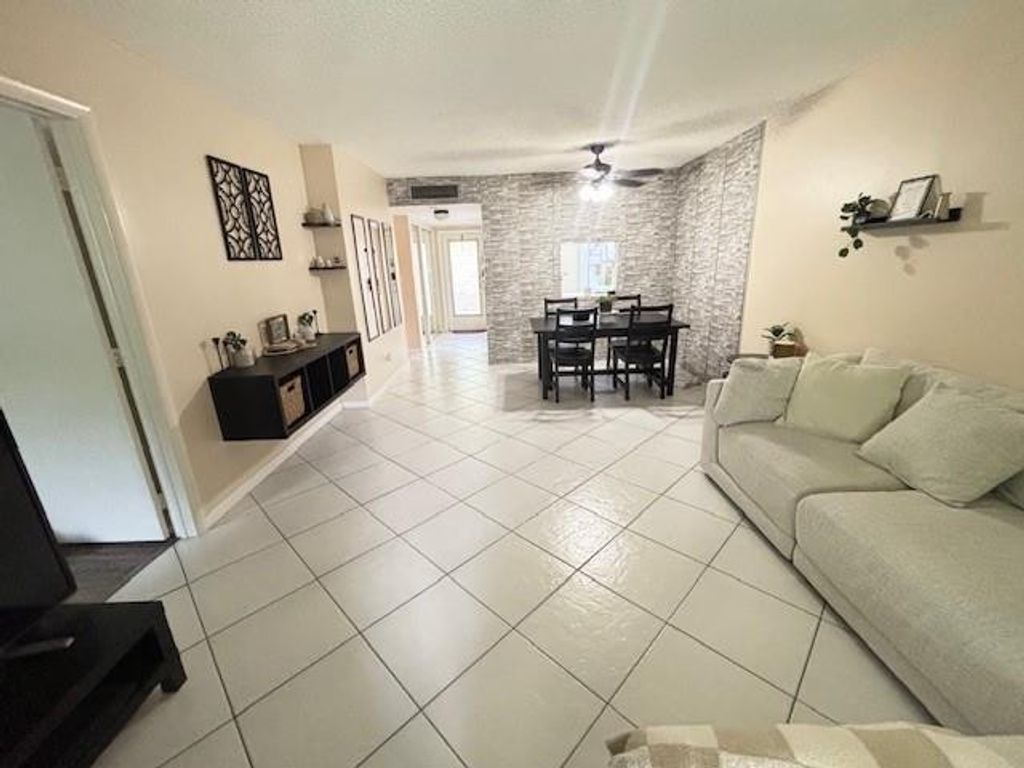 Photo of 6161 NW 57th Court #103, Tamarac, FL 33319 (MLS # F10529354)