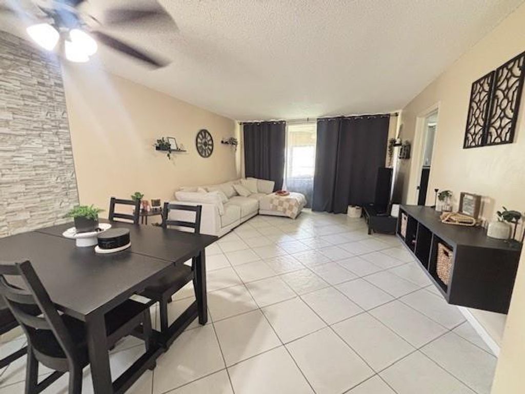 Photo of 6161 NW 57th Court #103, Tamarac, FL 33319 (MLS # F10529354)