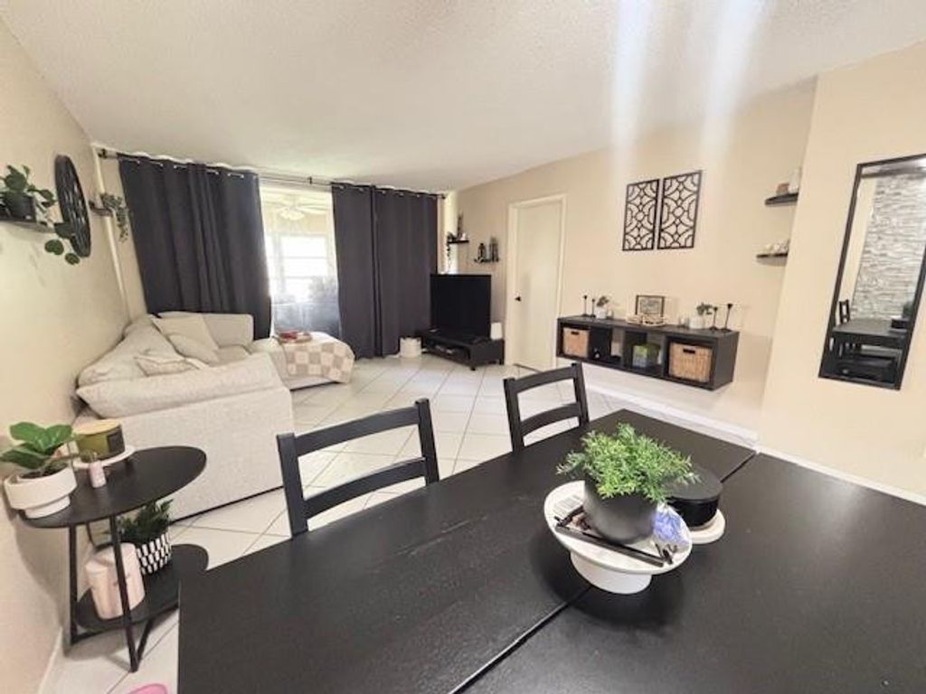 Photo of 6161 NW 57th Court #103, Tamarac, FL 33319 (MLS # F10529354)