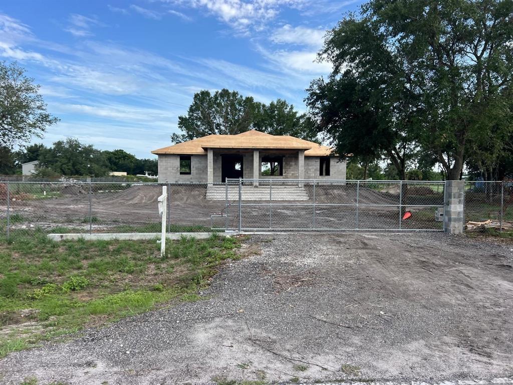 Check out this new construction in Montura Ranch Estate, Clewiston, FLORIDA, with 2025 sqft of Total Area. This home features a modern design, with attractive design choices in flooring, cabinetry, granite countertops, lighting, and large impact windows that allow for natural light. Spacious living spaces, a great room plan, three bedrooms, and two bathrooms. The master bedroom will have a shower and bathtub, as well as a dual sink. The kitchen features stainless steel appliances and a granite countertop. A paved driveway, sweeping entry gate, and grand staircase are all elegant and tasteful. The home sits on a private, fenced 1.25-acre lot. Enjoy your private oasis. NO HOA REQUIRED. THE HOUSE IS EXPECTED TO BE COMPLETED BY AUGUST.