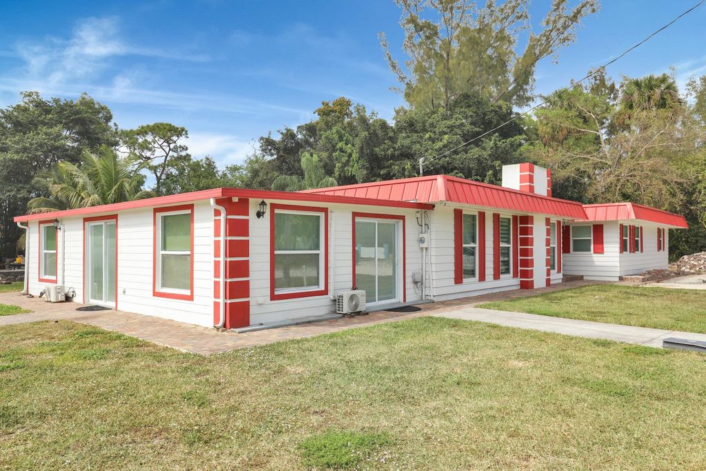 Photo of 140 Possum Pass Pass, West Palm Beach, FL 33413 (MLS # R11166914)