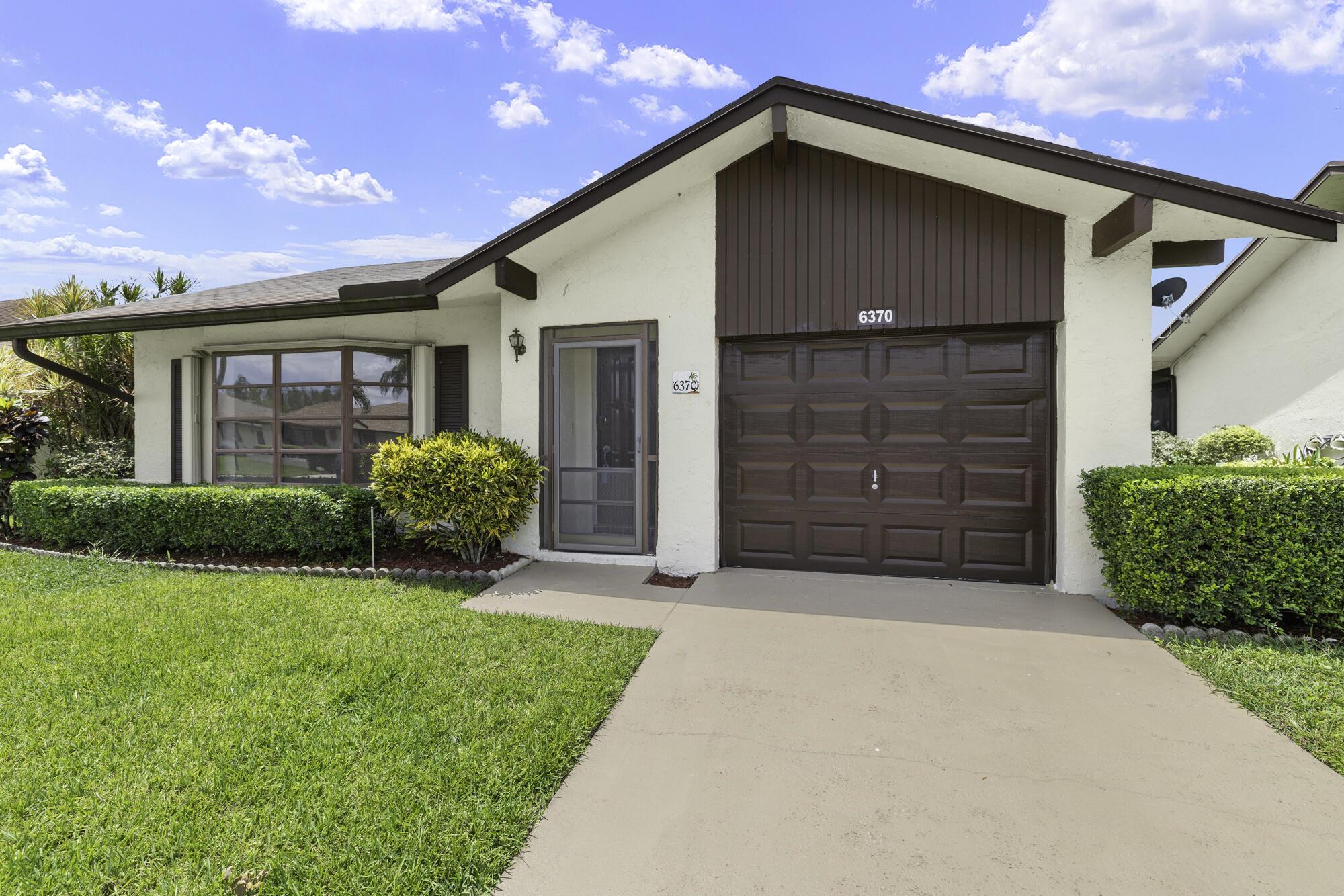 Welcome to your new home in the desirable Buttonwood 55+ community nestled in the heart of Greenacres. This beautifully maintained 2-bed 2-bath, 1 car garage home offers the perfect blend of quaint living and timeless charm. The 2 bedrooms are generously sized, Brand new flooring through-out. providing ample space for relaxation and privacy. 2020 AC Unit. Accordion shutters. Washer/Dryer included. Amenities include: Pickleball, Tennis, Pool, Hot Tub, Exercise Room, Shuffleboard, Bocci Ball & Card Games. HOA fees include Hotwire cable, exterior painting every 8-10 years, comprehensive lawn care, evening security and more.