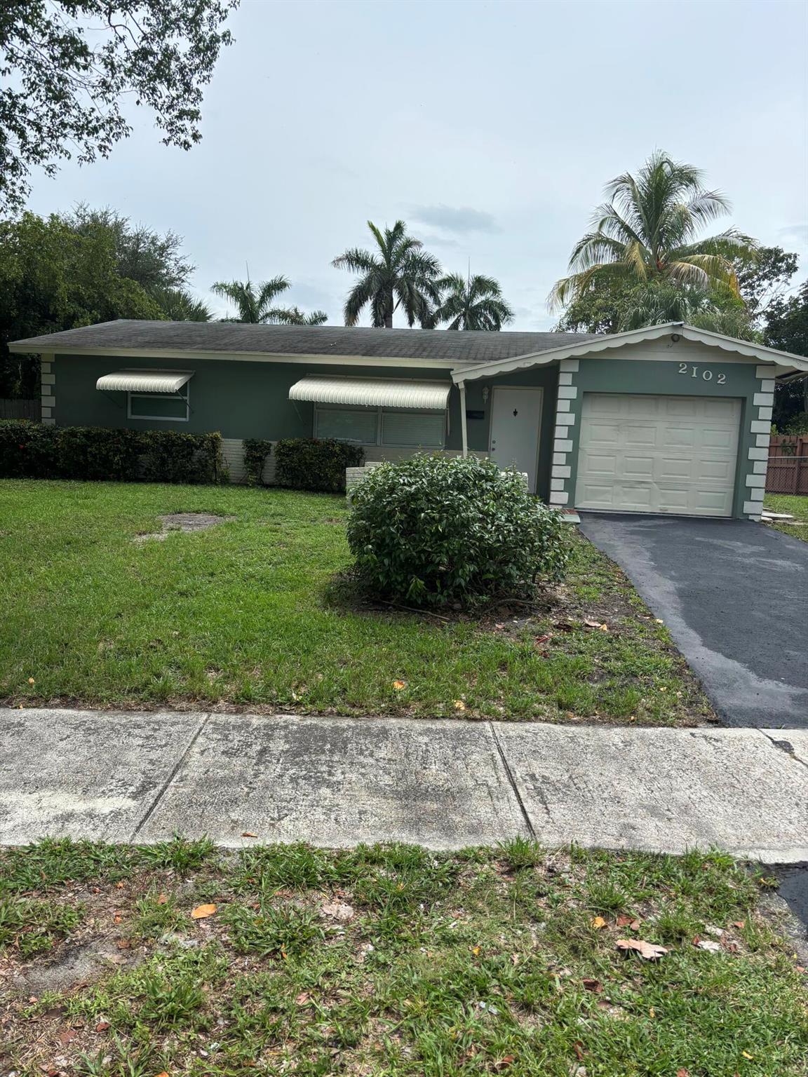 Spacious 3-bedroom, 2-bath corner home located just minutes from I-95, shopping centers, restaurants, and only a 10-minute drive to the beach. This beautifully updated home features a modern kitchen with brand-new granite countertops, stainless steel appliances, new tile flooring throughout, all new impact windows and doors, and fully renovated bathrooms.Enjoy a large fenced-in backyard with a private pool, open patio area--perfect for entertaining or relaxing outdoors. The garage has been professionally converted into a third bedroom, offering additional living space.Pool and lawn maintenance are included in the rent.