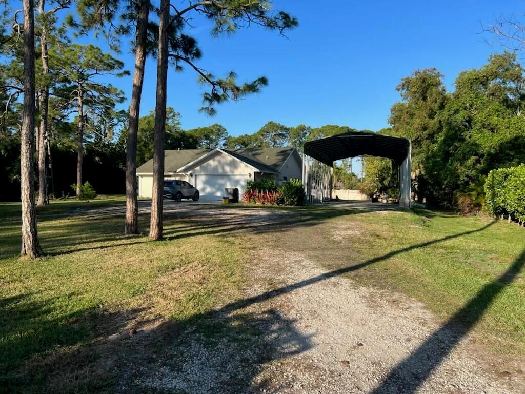 Photo of 4811 122nd Drive N, West Palm Beach, FL 33411 (MLS # R10869192)