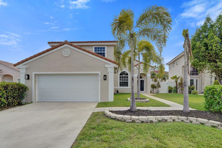 Elegant 4BD/3BA residence blending luxury living with family comfort. Soaring vaulted ceilings create a bright, open feel, while a desirable first-floor bedroom offers flexibility for guests or multi-generational living. The custom kitchen features premium cabinetry, a center island, and flows seamlessly into the main living space with a sleek built-in electric fireplace. Step outside to a private, professionally landscaped backyard designed for entertaining—complete with an in-ground pool, travertine decking, and outdoor kitchen/bar. Major upgrades include impact windows/doors (2026), HVAC (2025), and barrel tile roof (2010). Located in a sought-after community with top-rated schools, pool, tennis, and basketball courts.