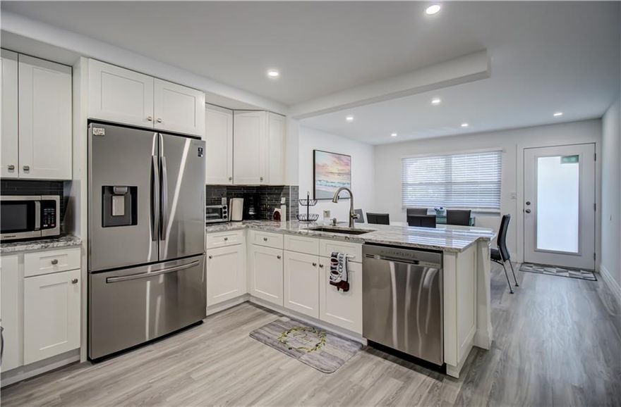 TOTALLY REMODELED PENTHOUSE INCLUDES AN INSIDE WASHER AND DRYER & ALL FURNITURE TURN-KEY EVEN WITH A 70" TV- JUST BRING YOUR TOOTHBRUSH* A QUIET SIDE OF WYNMOOR WITH PARK LIKE VIEW*ALL IMPACT GLASS WINDOWS & DOORS*NEW SLIDING GLASS DOOR FROM BEDROOM TO PATIO*NEW A/C INSTALLED MAY 2022*NEW WATER HEATER W/OVER FLOW PAN*GRANITE COUNTERS*NEW FRAME-LESS SHOWER DOORS*PATIO FACES NORTH-BEST EXPOSURE BRIGHT W/OUT HOT SUN*NEW CEILING FANS*TWO POCKET DOORS TO BATHROOM WITH FROSTED GLASS*IMPACT FRONT DOOR WITH FROSTED GLASS*SAMSUNG FRENCH 3-DOOR REFRIGERATOR/FREEZER*ALL SS APPLIANCES*SLIDE IN GLASS TOP STOVE*LOW MONTHLY MAINTENANCE*NEW DISHWASHER INTERIOR SS*MITIGATION INSPECTION REPORT AVAILABLE*PEACEFUL LOCATION SEE ALL PHOTOS THEN SEE FOR YOURSELF! PARK #143-OWNER LIVED THERE FOR 3 MONTHS-PARK 143 https://www.propertypanorama.com/2001-Granada-Dr-K4-Coconut-Creek-FL-33066/unbranded