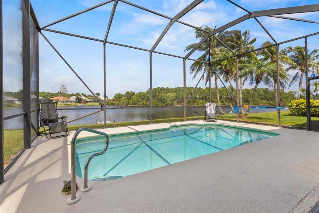 Photo of 614 SW Lake Charles Circle, Port Saint Lucie, FL 34986 (MLS # R11078662)
