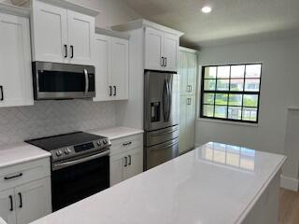 Photo of 102 Pinecrest Circle #C, Jupiter, FL 33458 (MLS # R11125860)