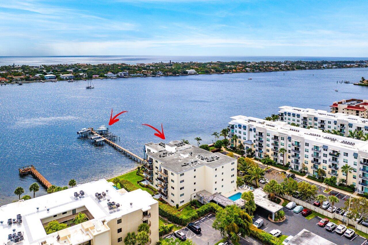 Experience premier waterfront living in this impeccably renovated 2-bedroom, 2-bathroom Intracoastal condo, complete with a boat slip and unobstructed ocean access with no fixed bridges. A rare offering, this third-floor residence delivers breathtaking water views and a lifestyle tailored for boating enthusiasts, right from your doorstep. Fully furnished and move-in ready, this exceptional home was extensively upgraded in 2023 with modern finishes and coastal-inspired design. Highlights include a fully renovated kitchen featuring quartz countertops, soft-close solid wood shaker cabinetry, farmhouse sink, stainless steel appliances, and a wine fridge. The open-concept living area is enhanced by new wood-look tile flooring, upgraded trim, recessed LED lighting, and expansive impact