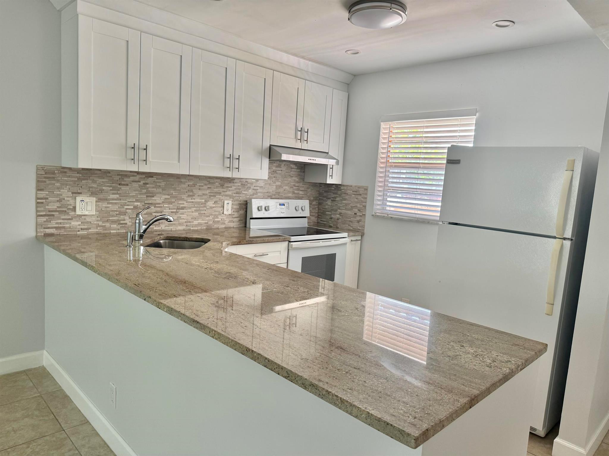Charming second-floor, one-bedroom, one-and-a-half-bath condo in Greenway Village, a 55+ community in Royal Palm Beach. This home offers a private, peaceful setting with the convenience of parking just steps from your front door. Residents enjoy access to a clubhouse, fitness center, shuffleboard, and two pools. Ideally located near Royal Commons Park, shopping, and dining.