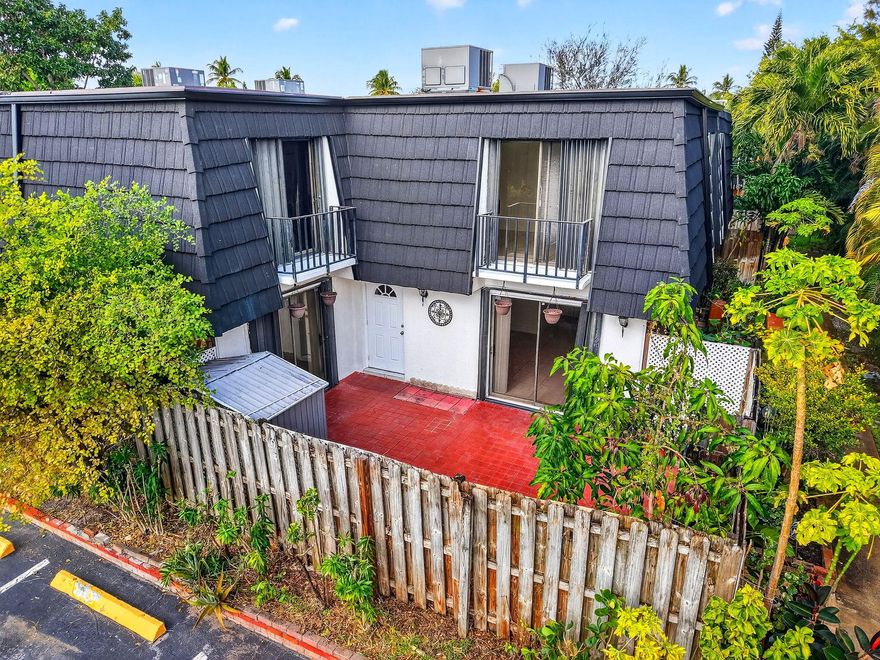 Beautiful corner unit offering exceptional privacy and natural light. This property features a bonus bedroom, brand-new roof, new stair flooring, and new appliances. Tile floors throughout enhance durability and easy maintenance. Enjoy a spacious private fenced patio, balcony access from the bedrooms, large walk-in closets, and an oversized laundry room. Low HOA fee includes common area maintenance, lawn care, building insurance, and cable. Centrally located with quick access to I-95, approximately 10 minutes to Palm Beach International Airport, and close to major shopping, dining, and everyday conveniences—many within walking distance or just minutes away. A must-see opportunity for comfortable living in a prime location.