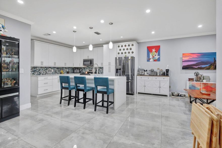PRICED TO SELL!!! Amazing location!  Highly sought-after Towngate Community.  Right in the heart of Pembroke Pines. COMPLETELY UPGRADED HOME!  HURRICANE IMPACT WINDOWS! Low HOA!  Beautiful open kitchen with a huge island!  Gorgeous quartz countertops. New cabinets and backsplash.  Plenty of room for entertaining.  Large 3 foot tile flooring on first level.  Tile throughout home.  Beautifully upgraded bathrooms.  A/C installed 2018. Excellent schools. New pavers in backyard for easy maintenance.  Multiple fruit trees in the backyard.  Smart mirror outlet in half bath.  Tons of association amenities including swimming pools, ball fields, fitness center, basketball court, playground, etc. DO NOT MISS OUT! MOTIVATED SELLER