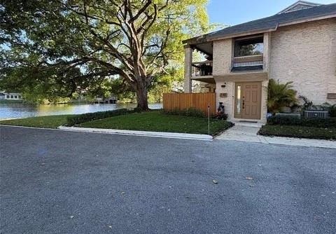 Amazing turnkey, completely renovated 3-bedroom, 2-bath corner condo. The second-floor unit has been tastefully updated throughout including marble flooring, granite countertops and stainless steel appliances. The open layout condo has been carefully renovated with all of the bells and whistles. The condo also includes impact windows, security cameras, top-of-the-line washer/dryer and updated A/C/water heater. The enclosed balcony faces the lake and the condo comes with 2 parking spots. Community amenities include: pool and tennis courts.