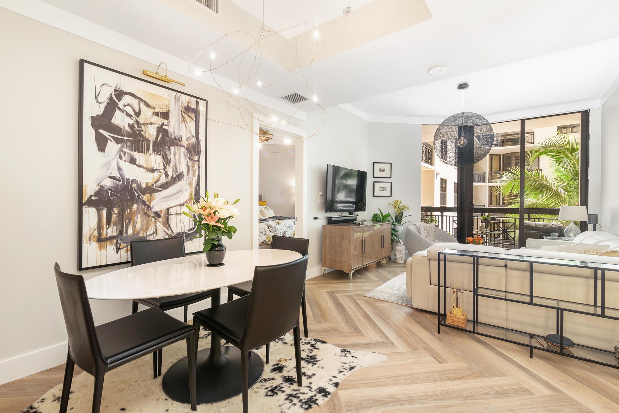 Welcome to your private oasis in the heart of CityPlace, West Palm Beach within the impeccably managed One City Plaza. This stunningly renovated 2BR/2BTH features rich, wood tile flooring, new appliances, an induction stove, California closets, and a spacious split floor plan with separate dining and breakfast bar. Bathrooms are adorned with quartz countertops, Brondell bidets and designer wallpaper. Electric shades, custom lighting, and a wraparound balcony create a serene retreat for you and your pets. Rarely offered: two assigned parking spaces and a storage unit. Enjoy resort-style living with a rooftop pool, new grilling stations, spa, sauna, fitness center, full-time doorman, valet. parking--all steps from vibrant shops, dining and fabulous Palm Beach.