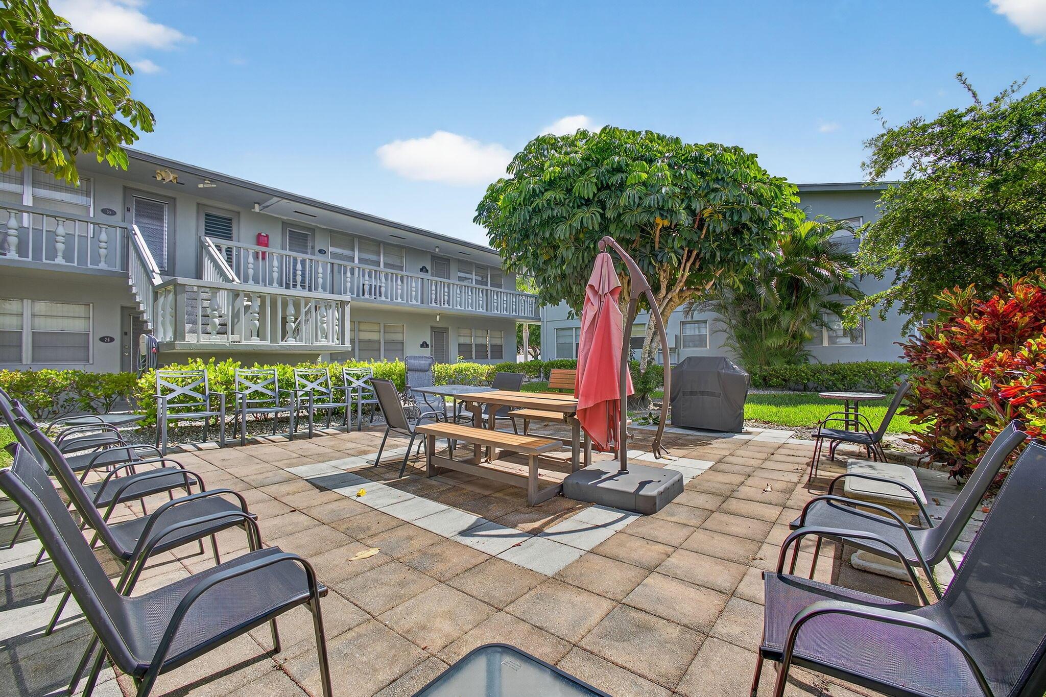 SAY HELLO TO THIS LIGHT AND BRIGHT SUN FILLED GROUND FLOOR 2 BED 1.5 BATH UNIT,LOCATED IN CENTURY VILLAGE A COMMUNITY FOR ACTIVE ADULTS 55+. LARGE CERAMIC TILE THROUGHOUT, WHITE KITCHEN, NEW TOILETS AND VANITIES, PLANTATION SHUTTERS. AIR CONDITIONING IS 5 YEARS OLD. WELL FUNDED BUILDING WITH NEW ROOF FRESHLY PAINTED AND NEW SIDEWALKS. LOVELY OPEN PATIO TO SIT OU T AND RELAX ON. CLOSE TO THE DORCHESTER POOL .Roomy closets (one walk-in), screened-in patio, laundry room, assigned parking spot plus visitor parking available; local bus for errands/shopping both within & outside THE VILLAGE COME AND ENJOY RESORT STYLE LIVING IN THIS GATED COMMUNITY FOR ADULTS 55+. Clubhouse with theater, shows, movies, craft and card rooms, billiards, aerobics, yoga, and dance classes. GREAT LOCATION: