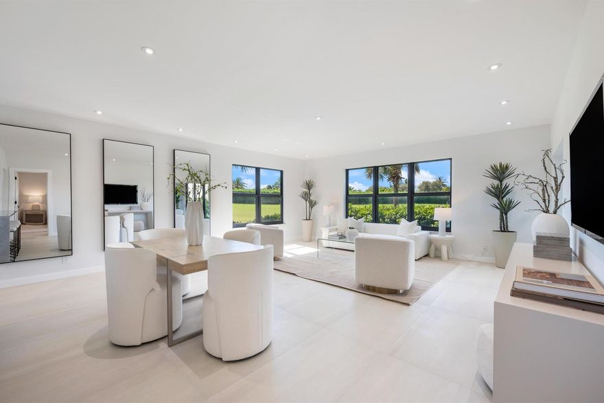 Experience a like-new condo in this completely rebuilt 3-bed, 2-bath END UNIT. No detail was overlooked, with everything taken down to the studs: new drywall, baseboards & trim, interior doors, kitchen, bathrooms, lighting & more. The open-concept floor plan is designed for modern living, seamlessly blending the kitchen, dining, and living areas into one light, bright, and airy space perfect for entertaining. It features an oversize island, brand-new appliances, and sophisticated, neutral finishes. The desirable split-bedroom floor plan offers maximum privacy,perfectly separating the primary suite from the guest rooms. The exterior is secured with new impact windows and doors, offering superior protection and energy efficiency. Located in the 800 building, this unit overlooks both golf &