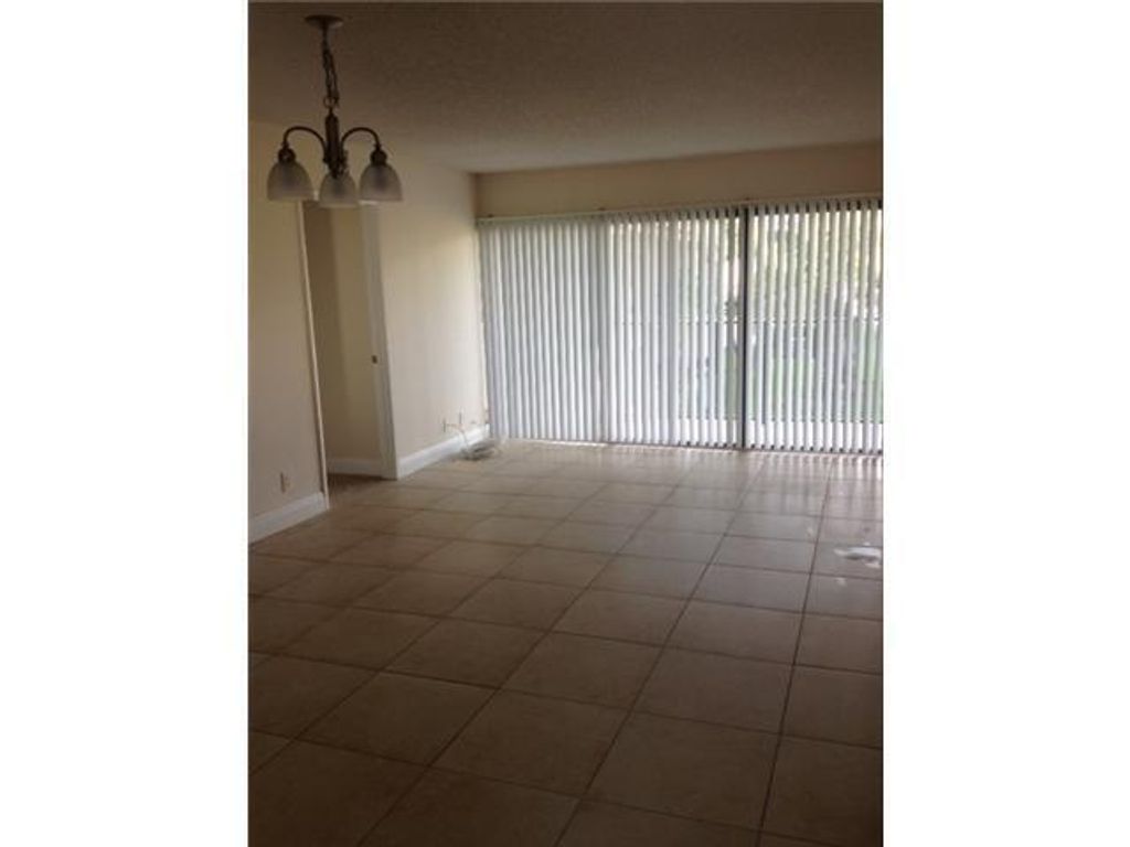 Photo of 1473 Lake Crystal Drive #F, West Palm Beach, FL 33411 (MLS # R11142567)